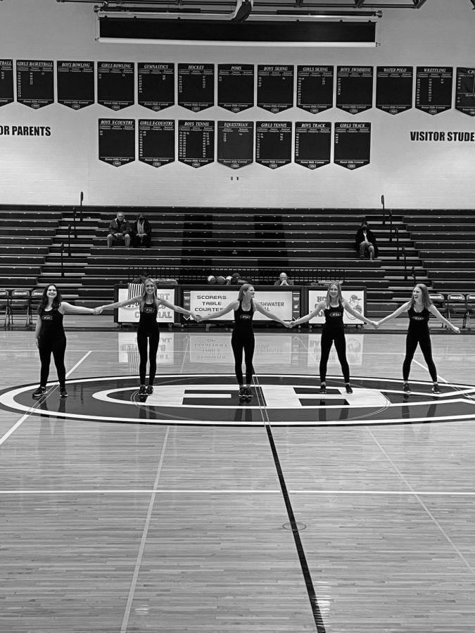 The five seniors at senior night on the basketball court
