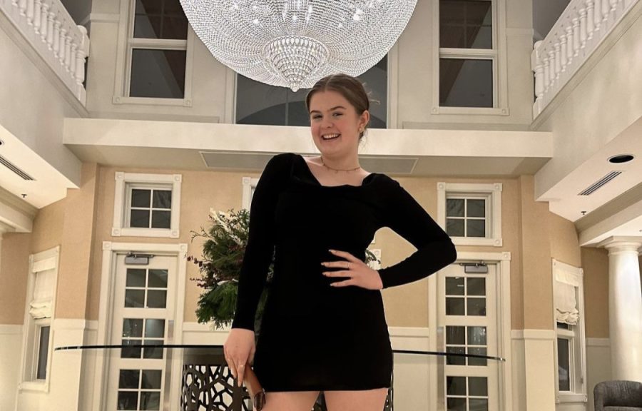 Sophomore Norah Vanderweide posing at the Inn at Bay Harbor